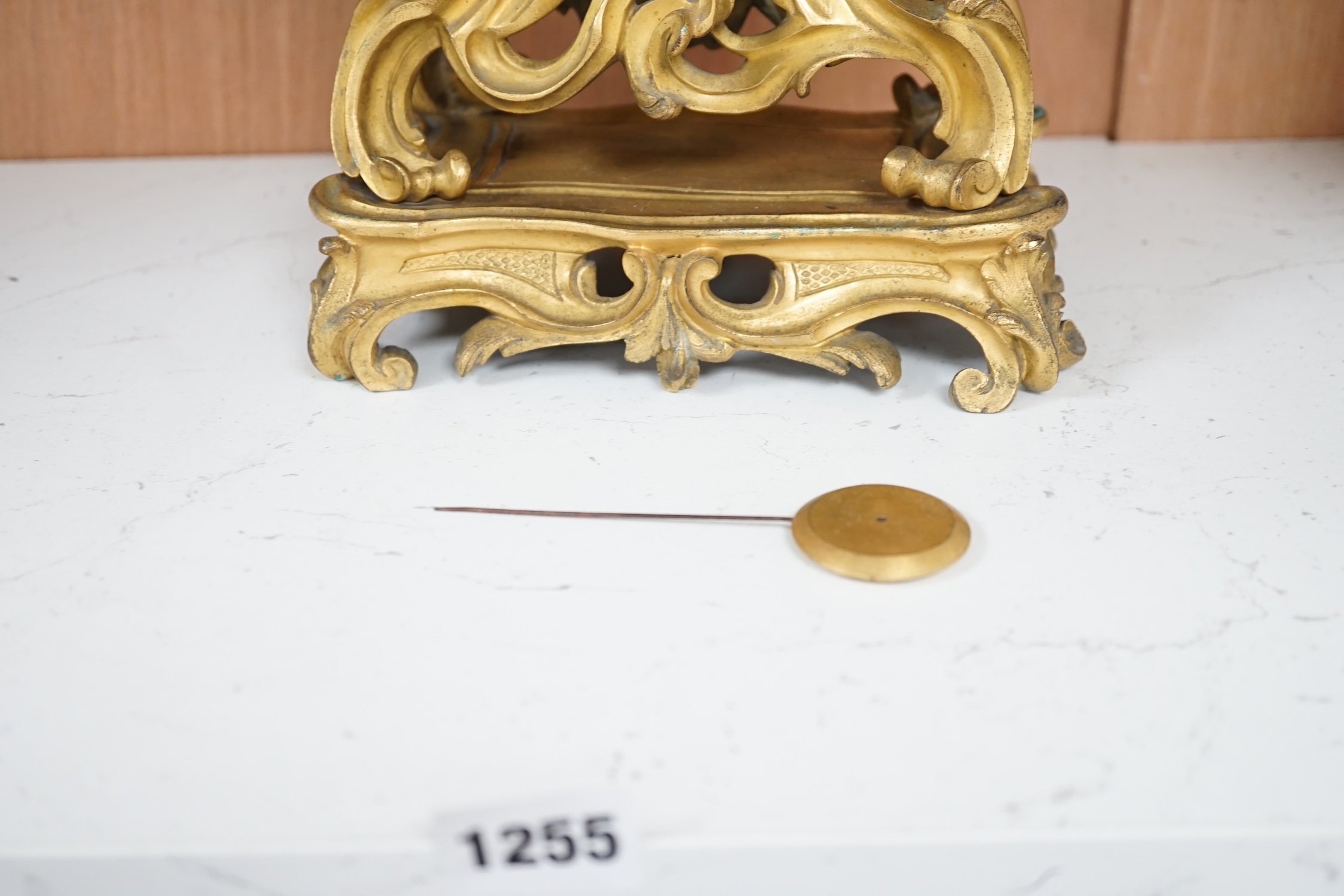 A 19th century French gilt metal mantel clock with Roman numeral dial, no key, pendulum a.f, 35cm high. Condition - fair